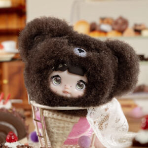 Nommi V9 100% Sweetness Series Blind Box featuring a cute doll in a bear hat, with a dessert background.