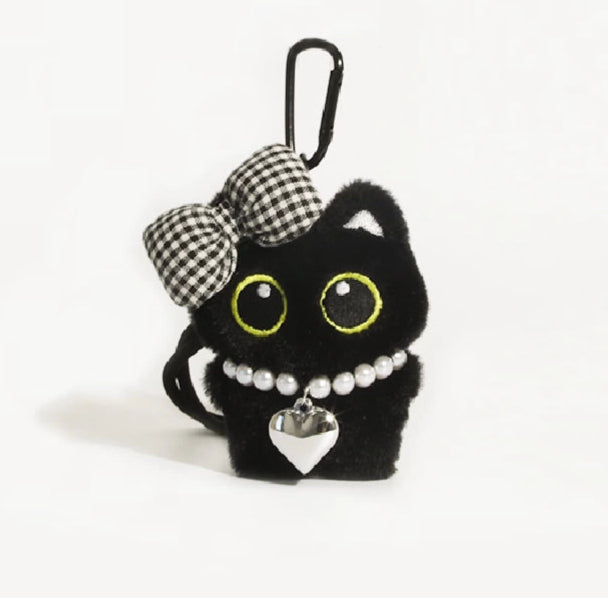 Big-eyed black cat plush keychain perfect for adding charm to bags and accessories