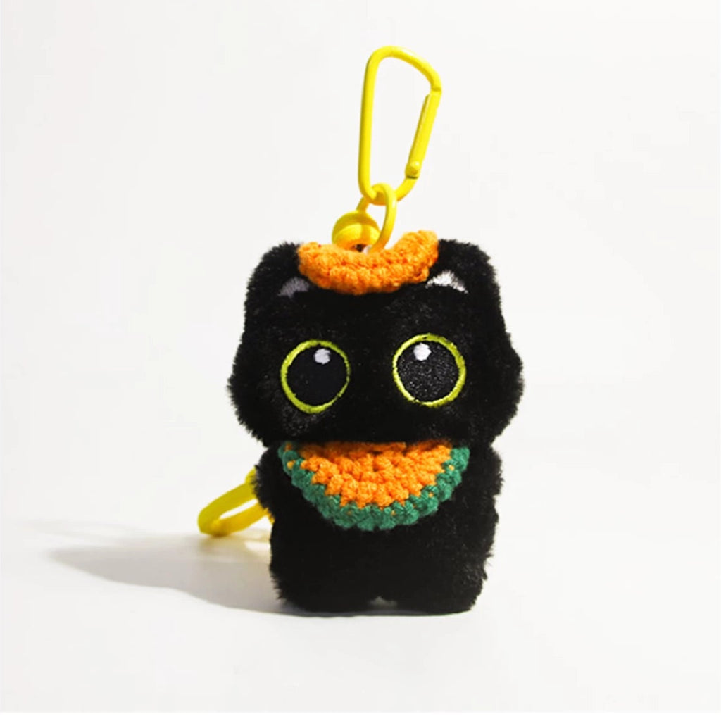 Big-eyed black cat plush keychain perfect for adding charm to bags and accessories