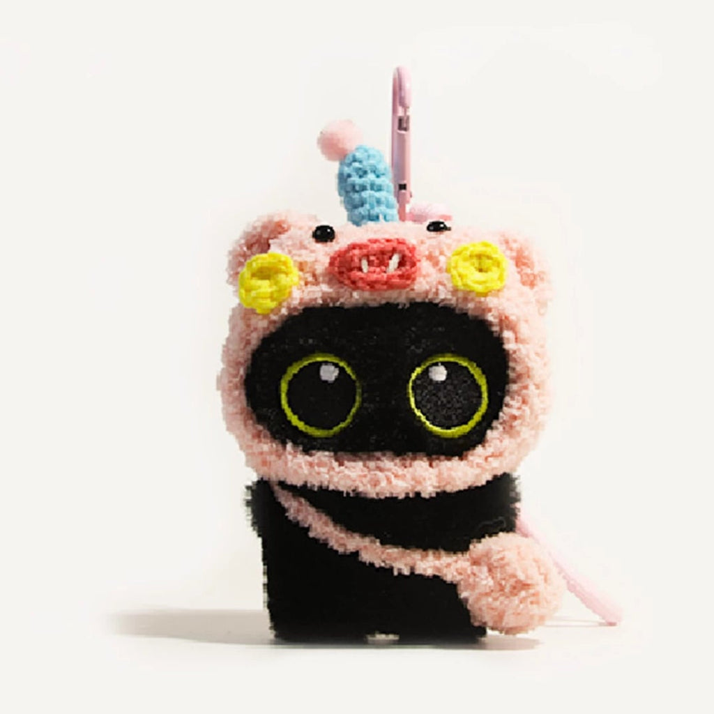 Big-eyed black cat plush keychain perfect for adding charm to bags and accessories