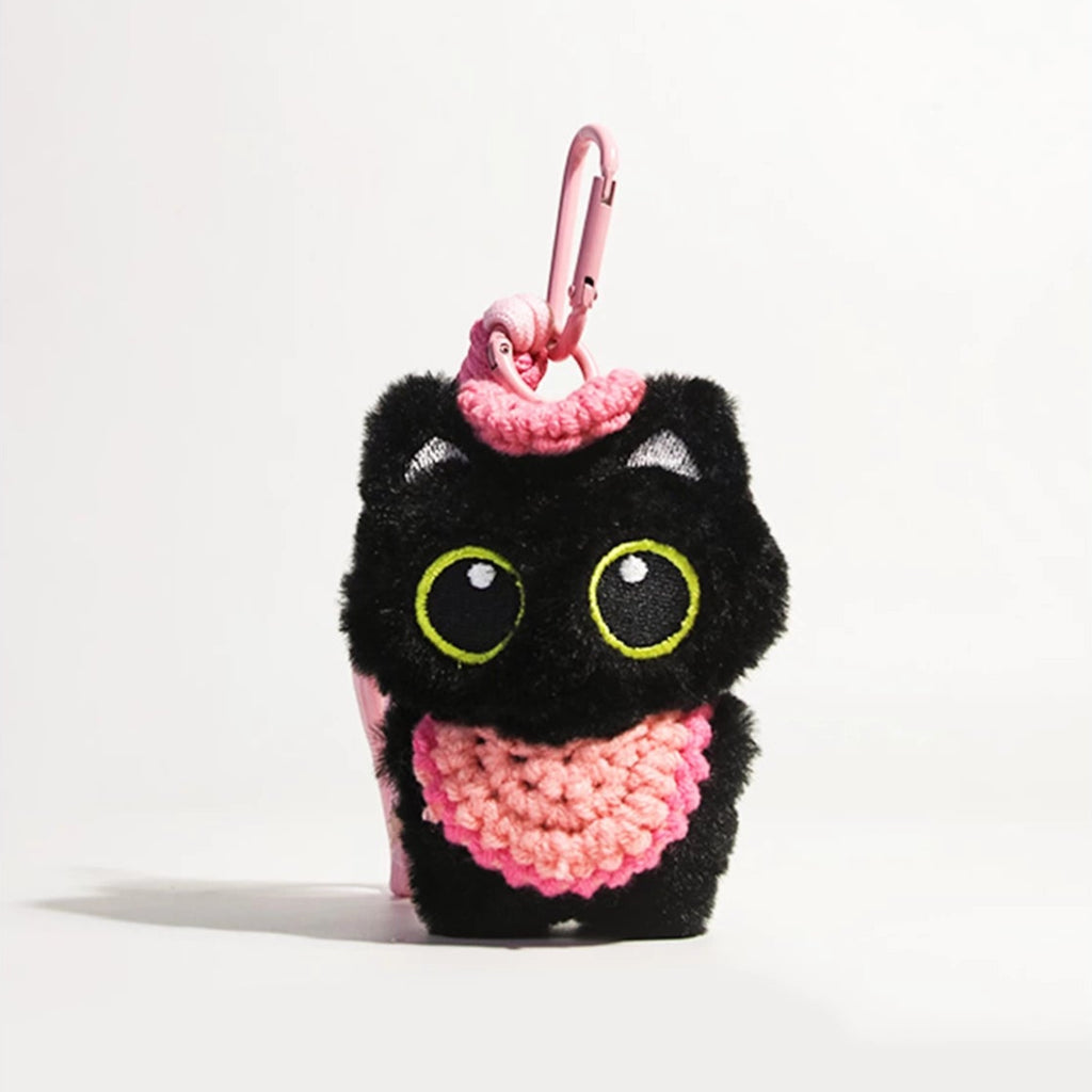Big-eyed black cat plush keychain perfect for adding charm to bags and accessories