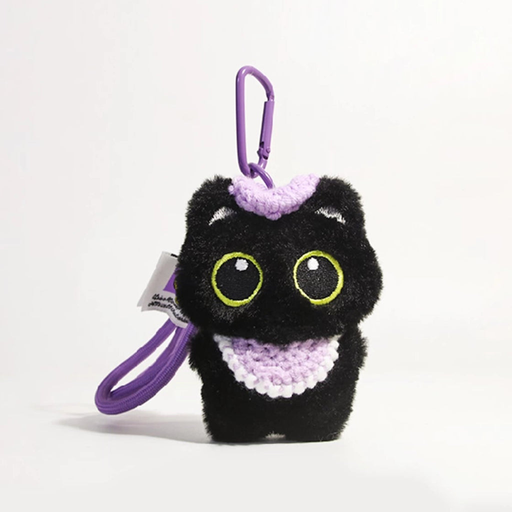 Big-eyed black cat plush keychain perfect for adding charm to bags and accessories