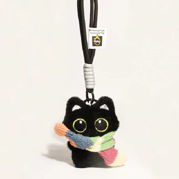 Big-eyed black cat plush keychain perfect for adding charm to bags and accessories