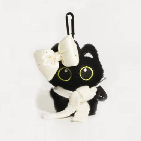 Big-eyed black cat plush keychain perfect for adding charm to bags and accessories