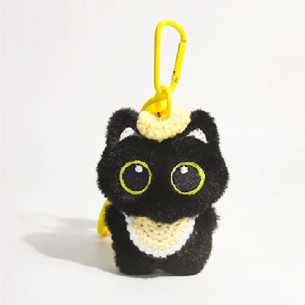 Big-eyed black cat plush keychain perfect for adding charm to bags and accessories