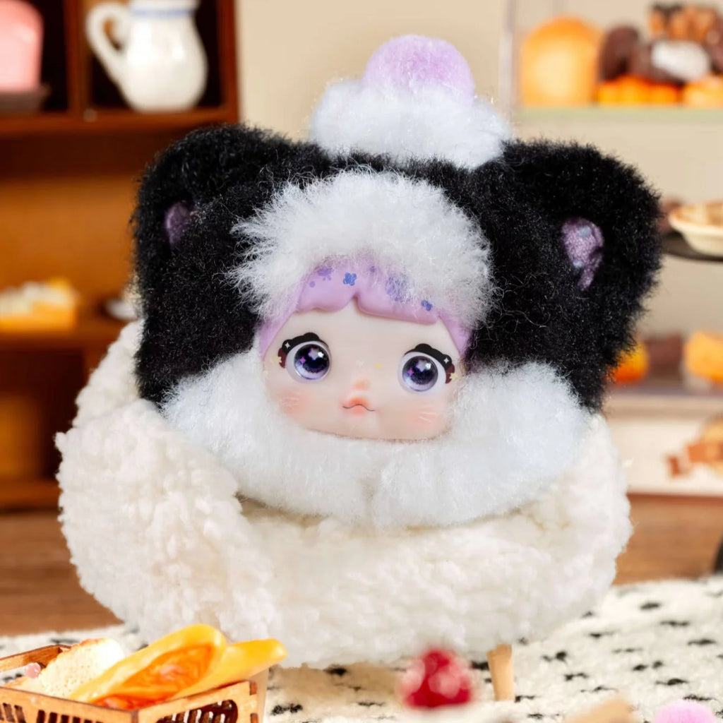 Nommi V9 100% Sweetness Series Blind Box featuring a cute plush character in cozy attire.