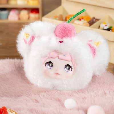 Nommi V9 100% Sweetness Series Blind Box cute doll in fluffy dessert costume with cherry on top.