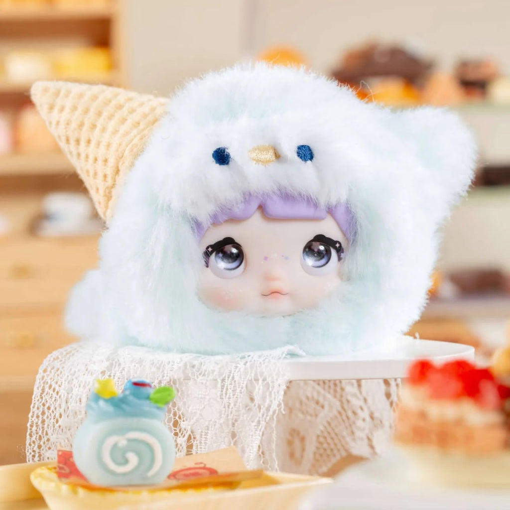 Nommi V9 100% Sweetness Series Blind Box character with a fluffy ice cream cone hat.